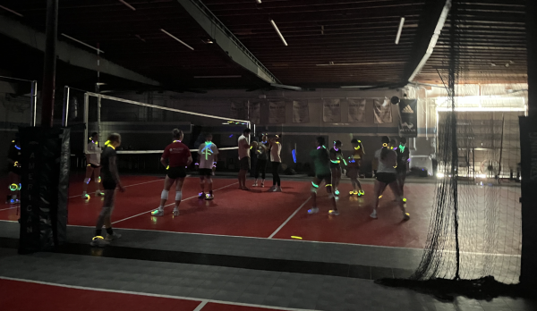 Glow sticks illuminate the Actyve Gym Friday, Oct. 11. To celebrate the end of their season, the JV volleyball team had a glow-in-the-dark themed practice with varsity, inspired by the popular TikTok trend. 